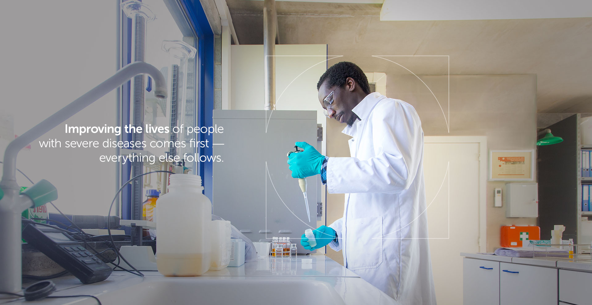 UCB researcher holding pipet in a white lab coat with overlaying text on how UCB improves lives of people living with severe diseases 